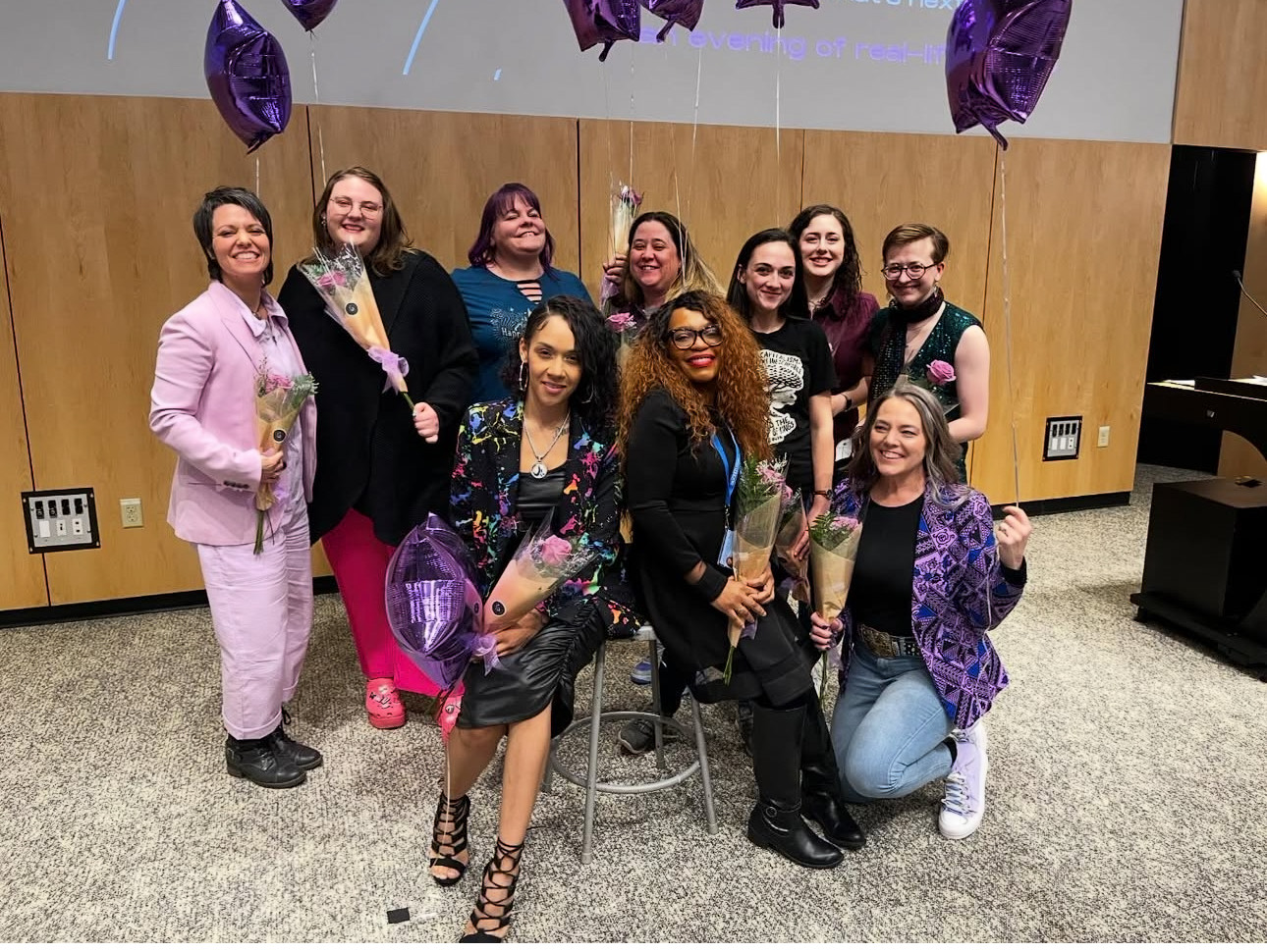 Frances Perkins Scholars with flowers and purple balloons