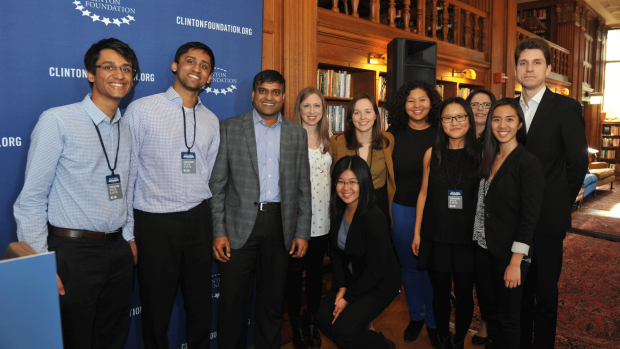 Photo of the winning code-a-thon team with Chelsea Clinton