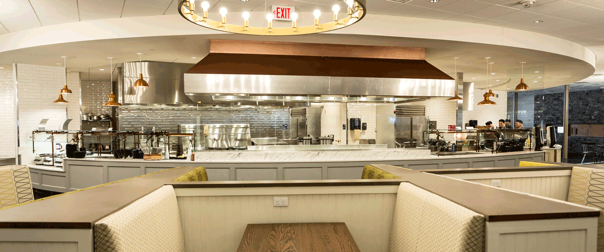 Photo of the inside of the dining commons booth seating and serving counter