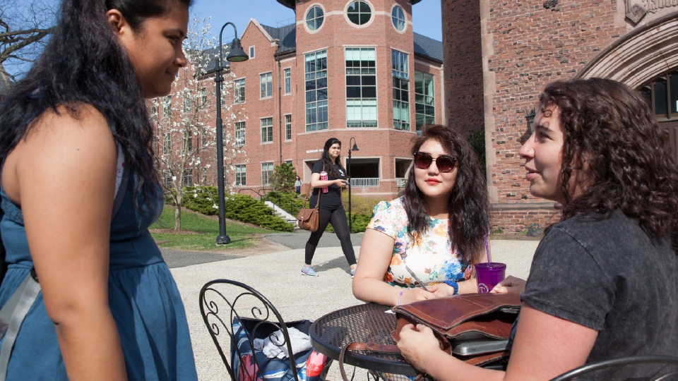 Three students talking outside of Kendade Hall Image of three students talking outside of Kendade Hall