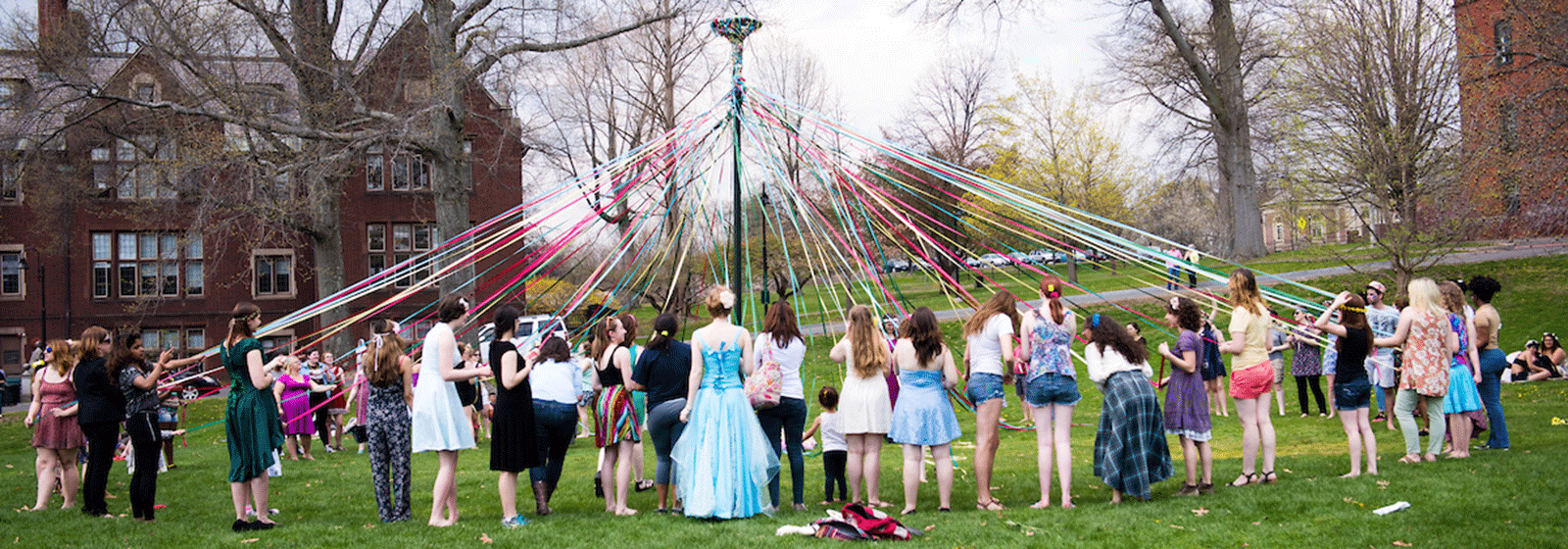 Photo of students dancing around the maypole