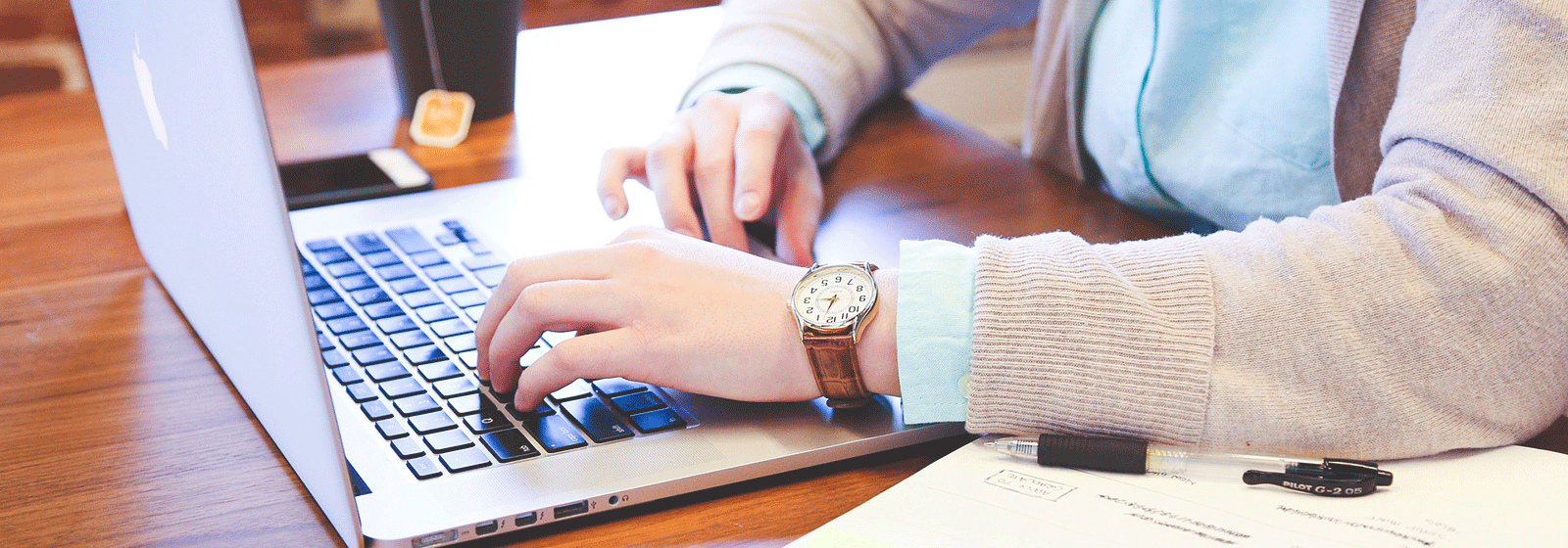 Photo of a person working on a laptop