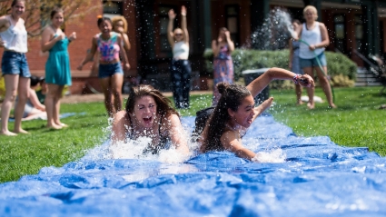 Students sliding on a hose run during Pangy Day 2017